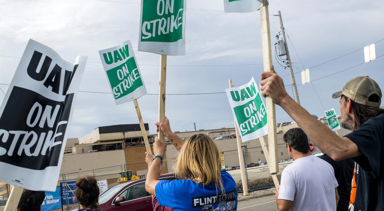 Flint resident Jashanti Walker, who has been a first shift team leader in the body shop for two years, demonstrates with more than a dozen other General Motors employees outside of the Flint Assembly Plant on Sunday, Sept. 15, 2019, in Flint, Mich. GM strike