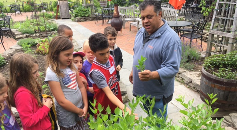 Harvest on Hudson owner Angelo Liberatore gives some kids from Hillside Elementary School a tasting tour. Angelo Liberatore