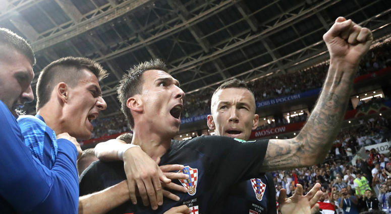 Croatia's Mario Mandzukic, center, celebrates after scoring his side's second goal during the semifinal match between Croatia and England at the 2018 soccer World Cup in the Luzhniki Stadium in Moscow, Russia, Wednesday, July 11, 2018. Croatia Beats England In World Cup