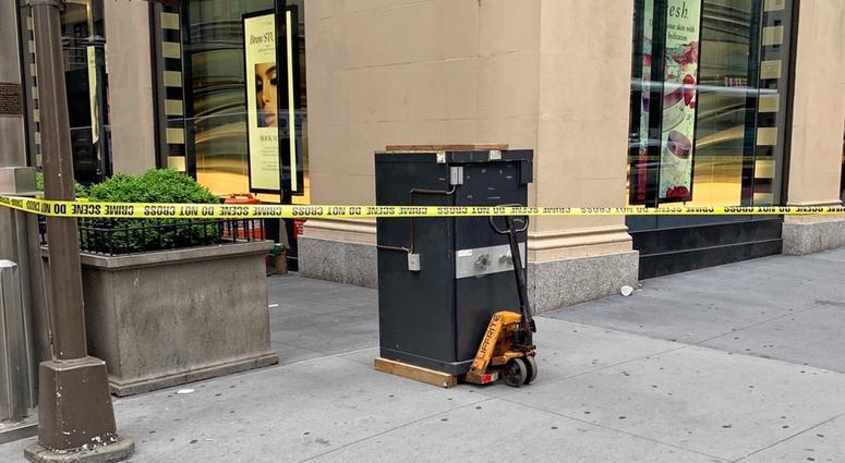 An abandoned safe left on a corner in Midtown Abandoned Safe