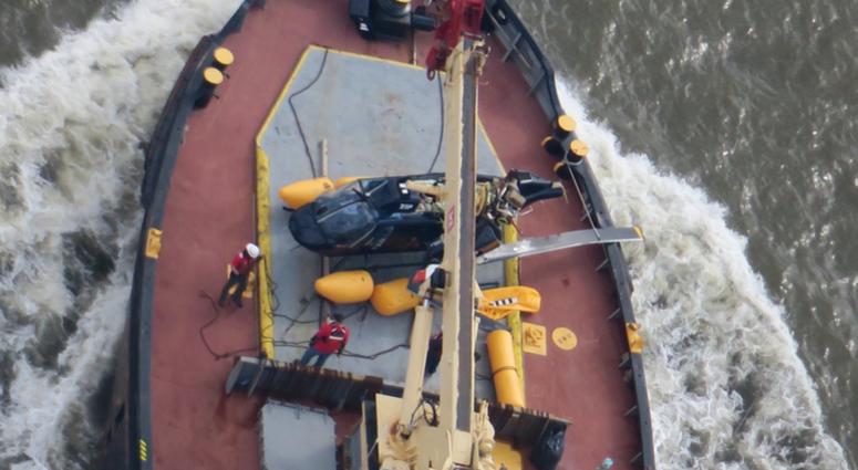 A helicopter overturned in the Hudson River. Helicopter in Hudson