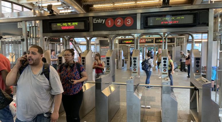 Riders search for alternate routes at 96th Street after the MTA suspended service on multiple lines during the evening commute on July 19, 2019. Subway Suspension