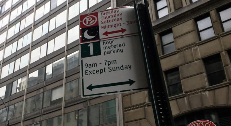 A sign indicating metered parking. Metered Parking Sign
