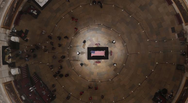 The last of the public files out of the Rotunda as the casket of the late former President George H.W. Bush lies in state in the Capitol Rotunda on December 5, 2018 in Washington, DC. George H.W. Bush