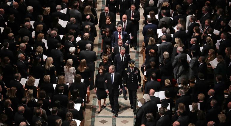 Members former President George H.W. Bush's family, including former President George W. Bush, Laura Bush, former Florida Governor Jeb Bush and Columba Bush, follow his casket out of the National Cathedral at the conclusion of his state funeral December 0 George H.W. Bush