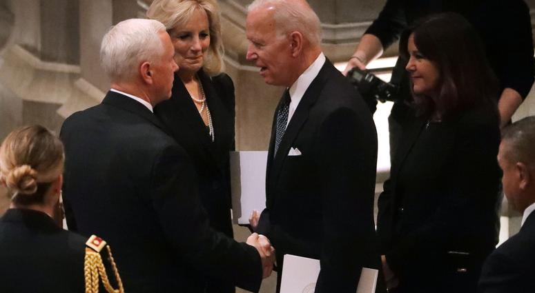 Vice President Mike Pence (L) talks with former Vice President Joe Biden and Jill Biden during the state funeral for former President George H.W. Bush at the National Cathedral December 05, 2018 in Washington, DC. George H.W. Bush