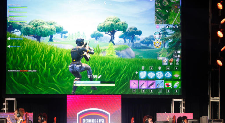 Students from Louisiana State University and The University of Washington compete in the online game Fortnite during DreamHack Atlanta 2018 at the Georgia World Congress Center on November 16, 2018 in Atlanta, Georgia. Fortnite