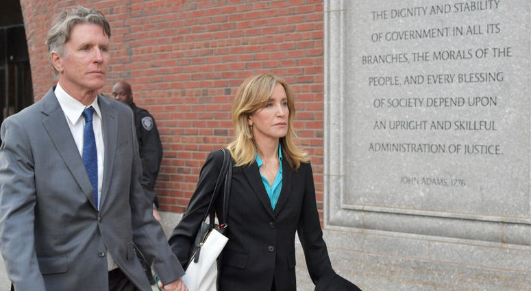 Felicity Huffman exits the John Joseph Moakley U.S. Courthouse after appearing in Federal Court to answer charges stemming from college admissions scandal on April 3, 2019 in Boston, Massachusetts. Felicity Huffman