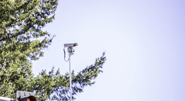 A red light camera at a traffic intersection Red Light Camera