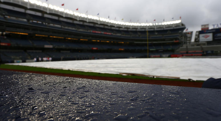 The tarp is seen on the field prior to the game between the Baltimore Orioles and the New York Yankees at Yankee Stadium on May 14, 2019 Yankee Stadium Tarp