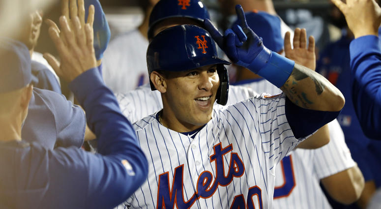 Wilson Ramos #40 of the New York Mets celebrates with teammates in the dugout after hitting a two run home run against the San Francisco Giants during the six inning at Citi Field on June 04, 2019. Wilson Ramos