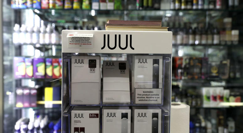 E-Cigarettes made by Juul are displayed at Smoke and Gift Shop on June 25, 2019 in San Francisco, California. E-Cigarettes