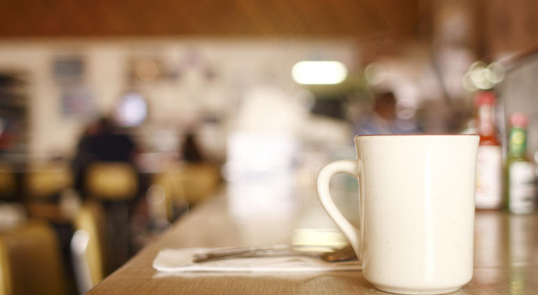 Cup of coffee on the counter at a diner. Diner