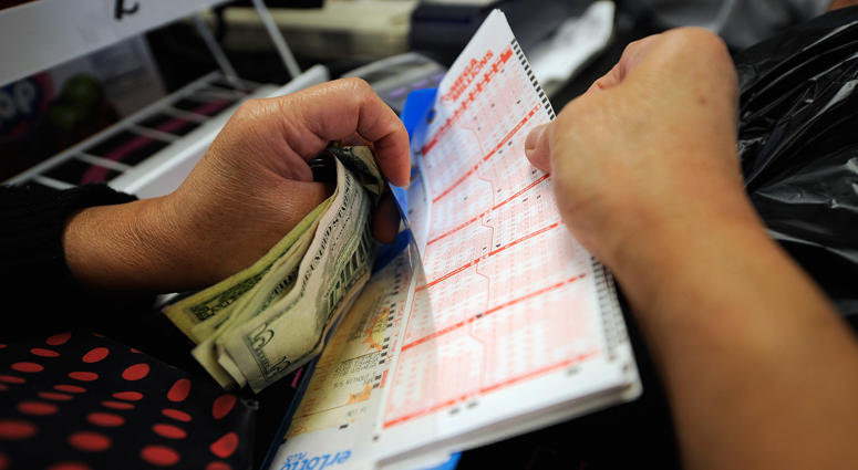 Customers buy their Mega Millions tickets Mega Millions