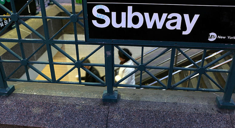 People enter the subway at Union Square on December 19, 2012 in New York City. Subway entrance