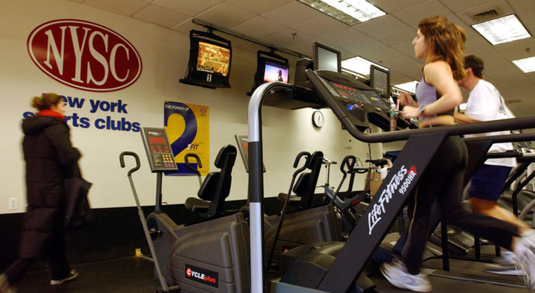 People run on treadmills at a New York Sports Club January 2, 2003 in Brooklyn, New York. New York Sports Club Gym
