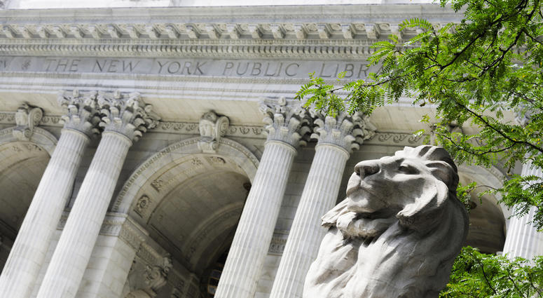 Angled view of the lion statue that flanks the front entrance to New York's Public Library. Public Library Lions