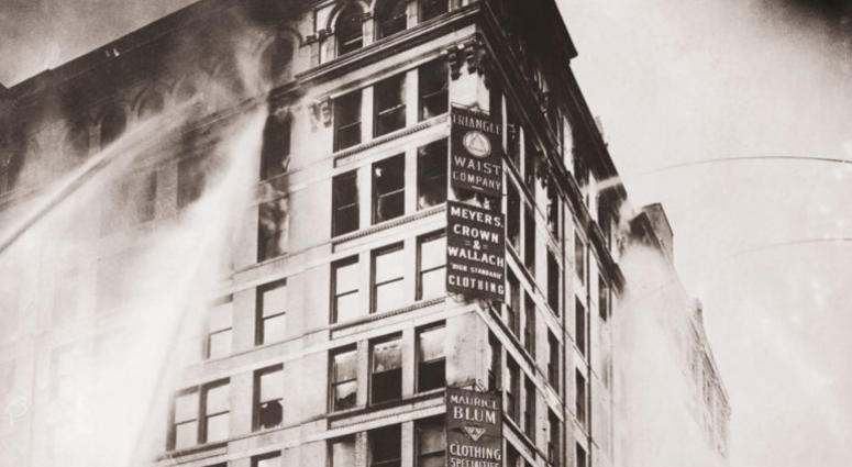 Fire hoses spray water on the upper floors of the Asch Building (housing the Triangle Shirtwaist Company) on Washington and Greene Streets, during the fire in New York City, March 25, 1911. Triangle Shirtwaist Factory fire