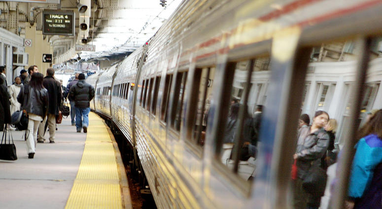 Passengers wait to board an Amtrak train in Penn Station April 2, 2004 in Newark, New Jersey. Newark Penn Station