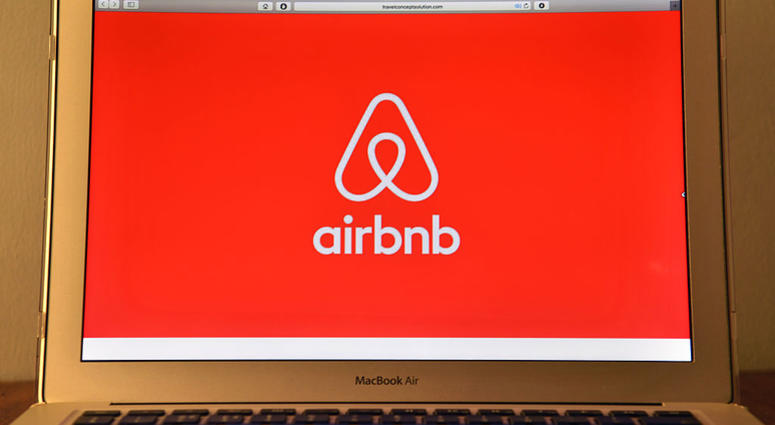 The Airbnb logo is displayed on a computer screen on August 3, 2016 in London, England. Airbnb logo