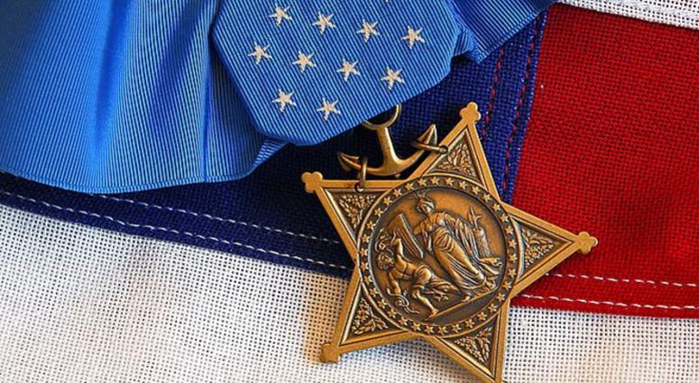 The Medal of Honor rests on a flag beside a SEAL trident during preparations for an award ceremony for Lt. Michael P. Murphy October 2, 2007 in Washington DC. Medal of Honor