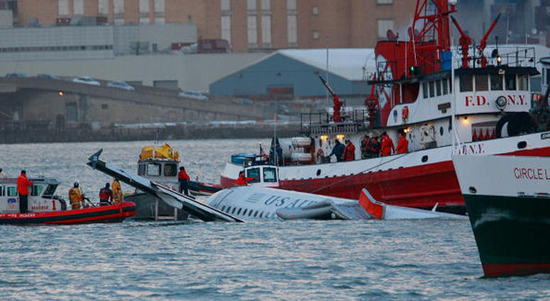 Rescue workers assist a New York City Fire Department boat pulled near a US Airways plane floating in the water after crashing into the Hudson River in the afternoon on January 15, 2009 in New York City. Miracle on the Hudson