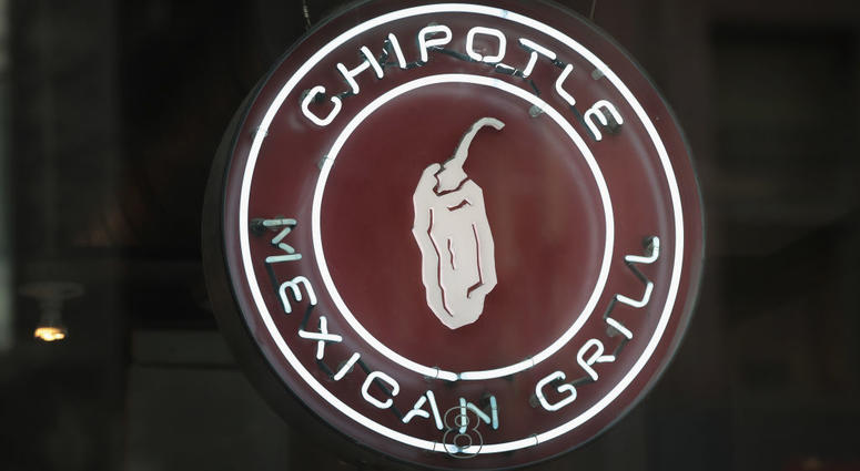 A sign marks the location of a Chipotle restaurant on October 25, 2017 in Chicago, Illinois. Chipotle