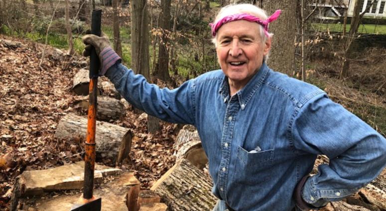 Bob Borsody splitting wood in a backyard in Westchester County. Bob Borsody