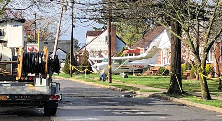 Small plane after going down on the front lawn of a Valley Stream home. Valley Stream plane crash