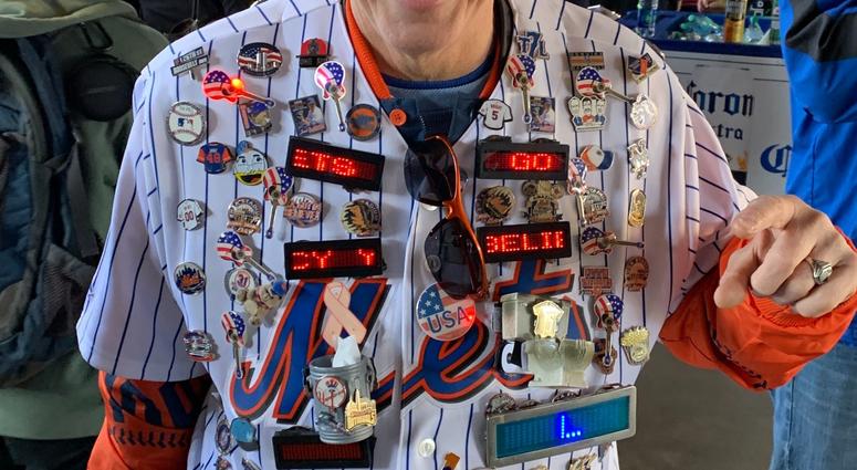 A fan arrives at Citi Field decked out in Mets gear. Citi Field Opening Day