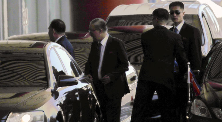 Kim Yong Chol, left, a former military intelligence chief who is now North Korean leader Kim Jong Un's top official on inter-Korean relations, accompanied by North Korean Ambassador to China Ji Jae Ryong, second from left, arrives at Beijing Capital Inter Kim Yong Chol
