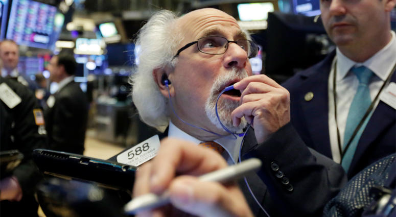 Trader Peter Tuchman works on the floor of the New York Stock Exchange, Tuesday, May 29, 2018. U.S. stocks are opening lower, following sharp drops in Europe triggered by political uncertainty in Italy. New York Stock Exchange
