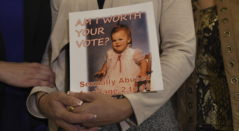 Carolyn Fortney, a survivor of sexual abuse at the hands of her family's Roman Catholic parish priest as a child, awaits legislation in the Pennsylvania Capitol to respond to a landmark state grand jury report on child sexual abuse in the Catholic Church.