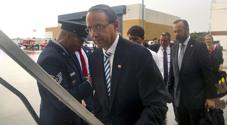 Deputy Attorney General Rod Rosenstein boards Air Force One in the rain, Monday, Oct. 8, 2018, in Orlando, Fla. Deputy Attorney General Rod Rosenstein Rod Rosenstein
