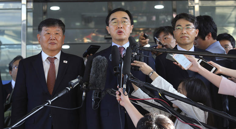 South Korean Unification Minister Cho Myoung-gyon, center, speaks to the media before leaving for the border village of Panmunjom to attend South and North Korean meeting, at the Office of the South Korea-North Korea Dialogue in Seoul, South Korea. South Korean Unification Minister