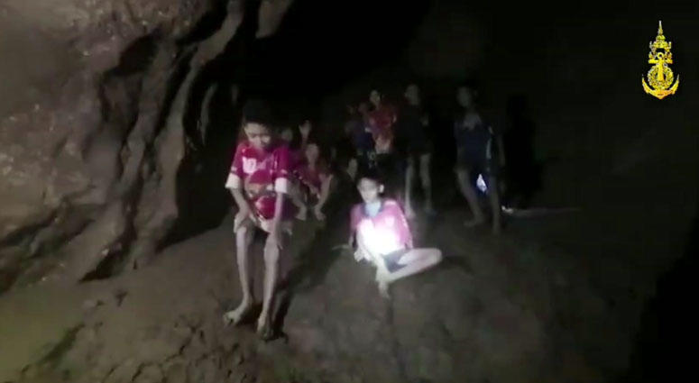 This Monday, July 2, 2018, photo released by Tham Luang Rescue Operation Center, shows the boys and their soccer coach as they were found in a partially flooded cave, in Mae Sai, Chiang Rai, Thailand. Thai Soccer Team In Cave Thai Soccer Team In Cave