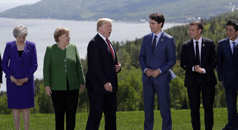 From left, British Prime Minister Theresa May, German Chancellor Angela Merkel, U.S. President Donald Trump, Canadian Prime Minister Justin Trudeau, French President Emmanuel Macron, Japanese Prime Minister Shinzo Abe gather for the family photo at the G- Trump At G7