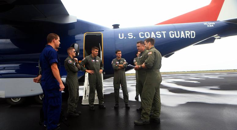Members of the Coast Guard Sector Corpus Christi prepare to do aerial view from cities on the Coastal Bend