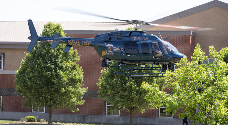 An Indiana State Police helicopter lifts off, which has been part of a large law enforcement presence outside a shooting at or near Noblesville West Middle School, Noblesville, Friday, May 25, 2018. Indiana School Shooting