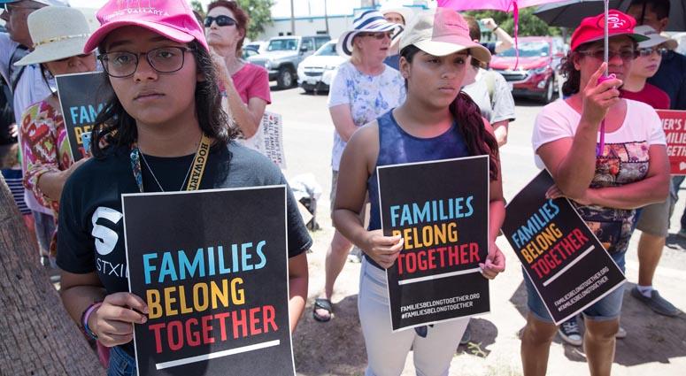 People gather for a vigil lead by the Families Belong Together campaign on Fathers Day outside U.S. Border Patrol McAllen Station calling for the end of family separation on Sunday. Family Separation