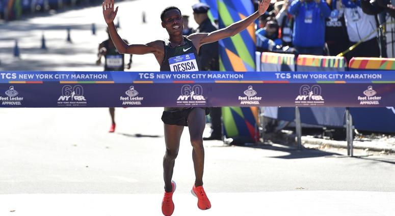 Lelisa Desisa crosses the finish line to win the professional men's division race of the 2018 TCS New York City Marathon. NYC Marathon