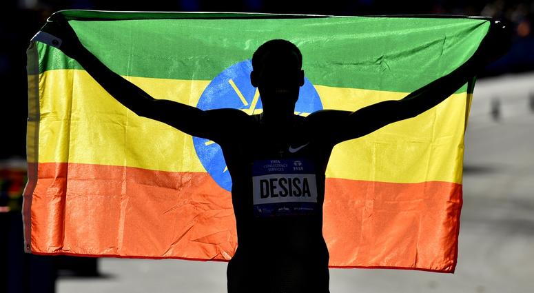 Lelisa Desisa celebrates after winning the professional men's division race of the 2018 TCS New York City Marathon. NYC Marathon