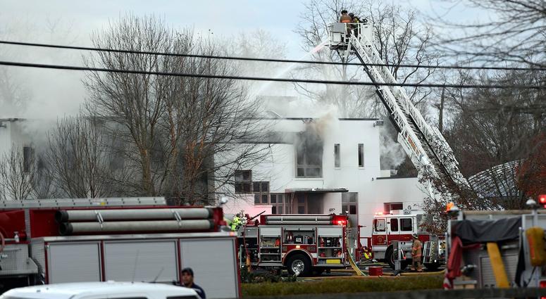 Colts Neck firefighters respond to a house fire off of Willow Brook Road on Tuesday, Nov. 20, 2018, in Colts Neck. Colts Neck Mansion Fire