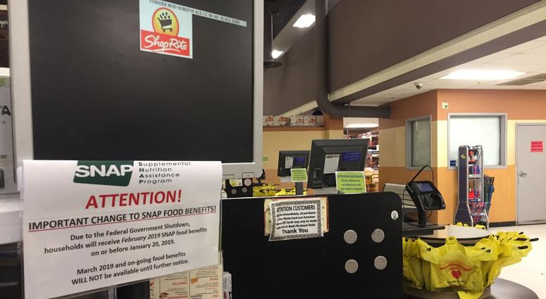 A flyer in Shoprite warns food stamp recipients that February funds will be issued in January A flyer in Shoprite warns food stamp recipients that February funds will be issued in January