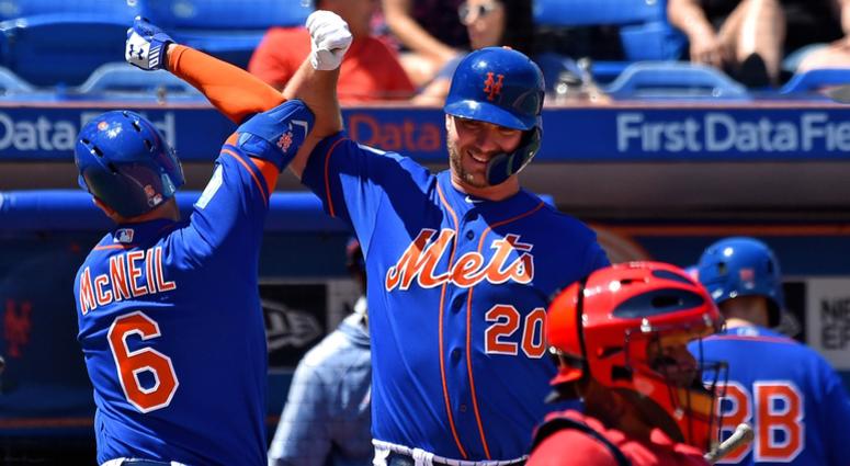 New York Mets infielder Jeff McNeil (left) is greeted by teammate Mets infielder Pete Alonso (right) after McNeil hit a solo home against the St. Louis Cardinals during a spring training game at First Data Field. Alonso and McNeil