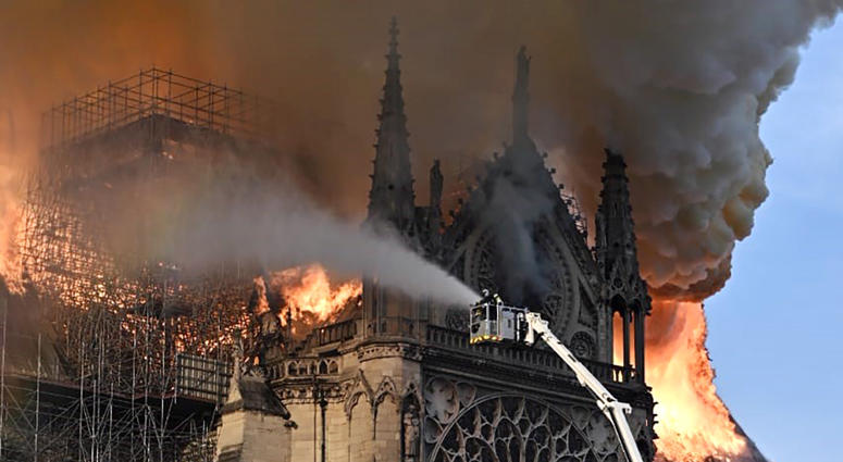 Firefighters battle a massive fire at the landmark Notre-Dame Cathedral, a Catholic cathedral founded in the 11th century. The fire has caused part of the historic church s spire to collapse as the blaze has spread along its roof. Notre Dame on Fire