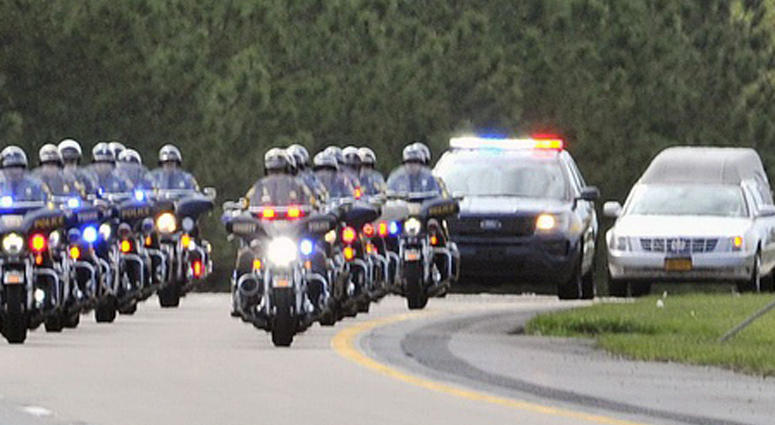 Procession heading north on Rt. 1 in Dover with the remains of New York city fireman and Marine S/Sgt. Christopher Slutman who was killed in a roadside bomb in Afghanistan on April 8, along with two other Marines. Firefighters Honor Fallen Marine