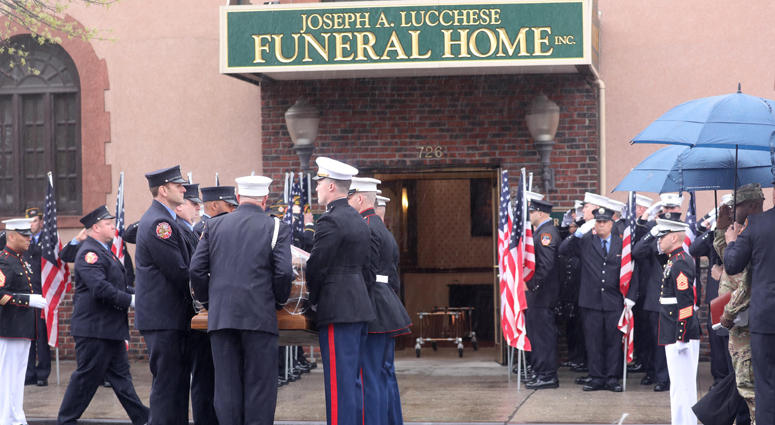 Members of the New York City Fire Department and U.S. Marine Corps carry the casket of FDNY member and U.S. Marine Christopher Slutman into the Joseph Lucchese Funeral Home in the Bronx April 21, 2019. Firefighters Honor Fallen Marine
