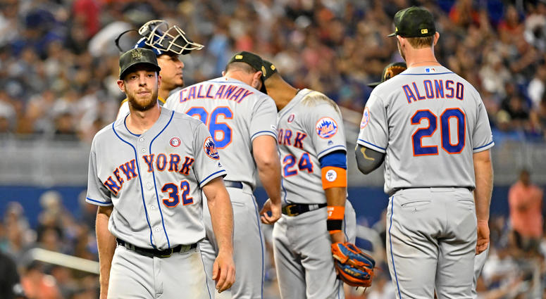 New York Mets starting pitcher Steven Matz (left) is taken out of the game by Mets manager Mickey Callaway (36) in the fourth inning against the Miami Marlins at Marlins Park. Mets Marlins