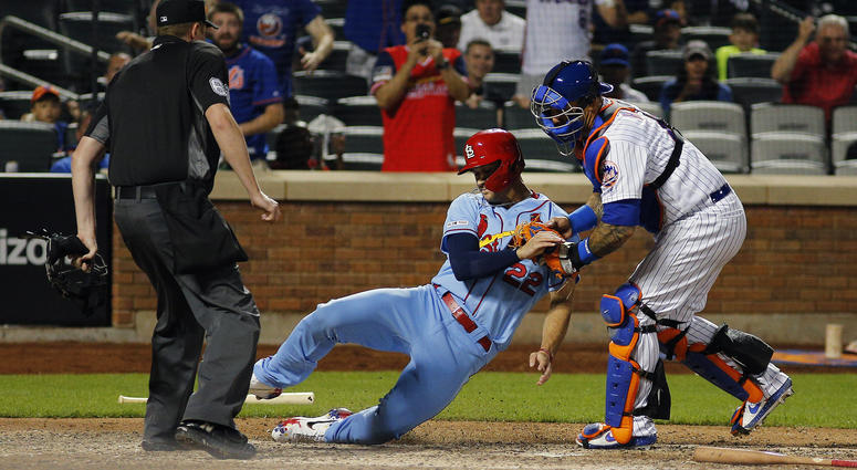 St. Louis Cardinals pinch runner Jack Flaherty (22) is tagged out at home plate by New York Mets catcher Wilson Ramos (40) attempting to score on a base hit during the ninth inning at Citi Field. Mets Cardinals